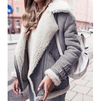 AdTec women's gray shearling jacket with cream faux fur lining and buckled cuffs.
