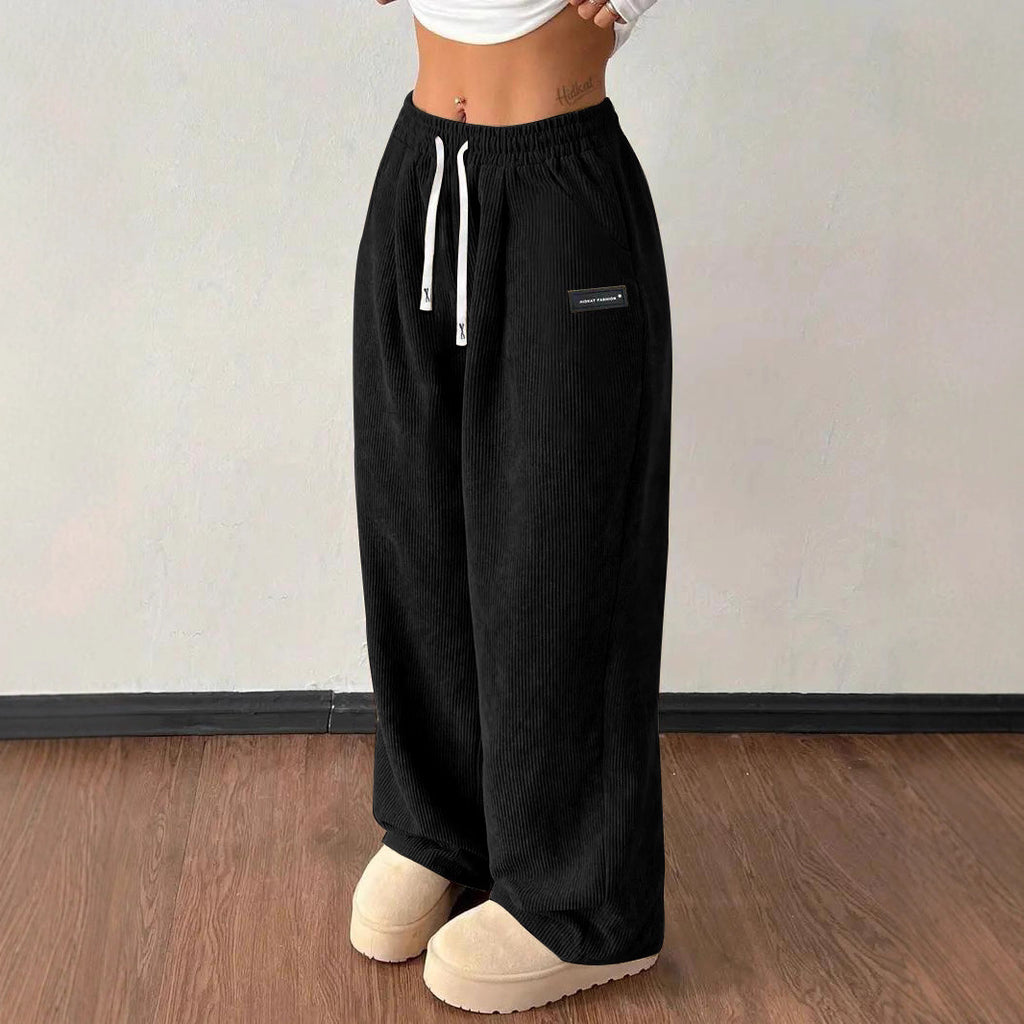 Pantalones de mujer informales versátiles de color liso con cordón suelto y bolsillos