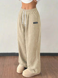 Pantalones de mujer informales versátiles de color liso con cordón suelto y bolsillos