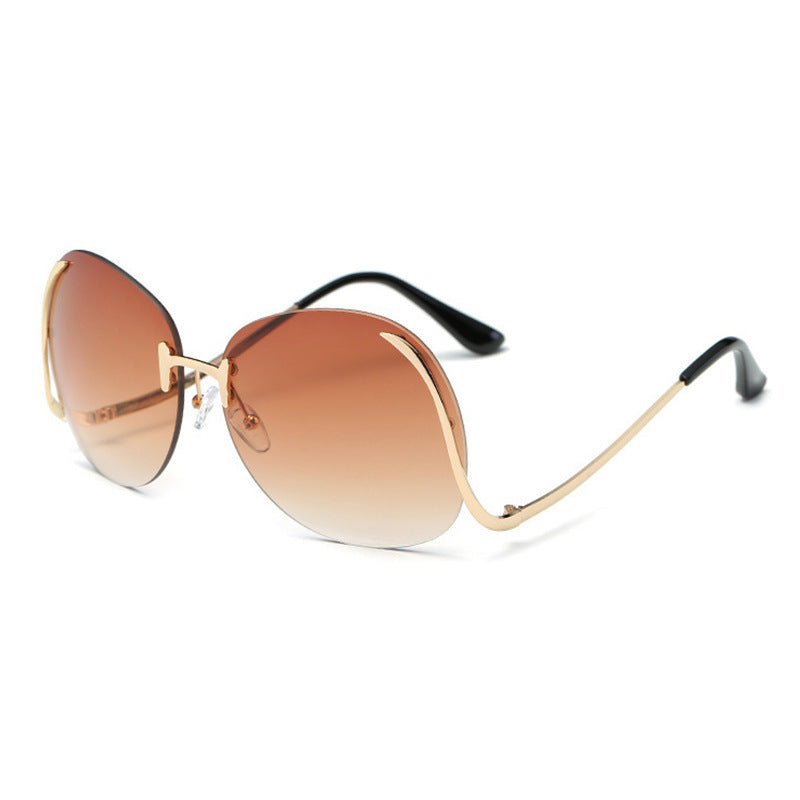 Lunettes de soleil sans monture à branches incurvées et décoratives