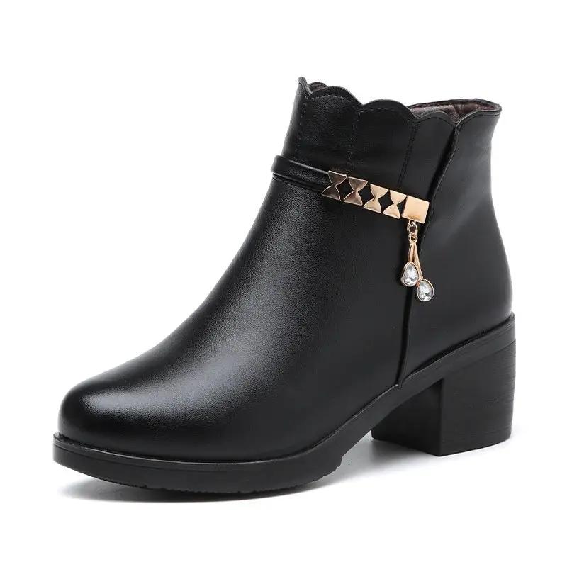 Black leather ankle boot by AdTec with gold stud strap and crystal pendant, anti-slip, block heel.