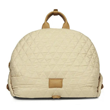 Pet handbag in beige quilted fabric with tan leather handles and trim
