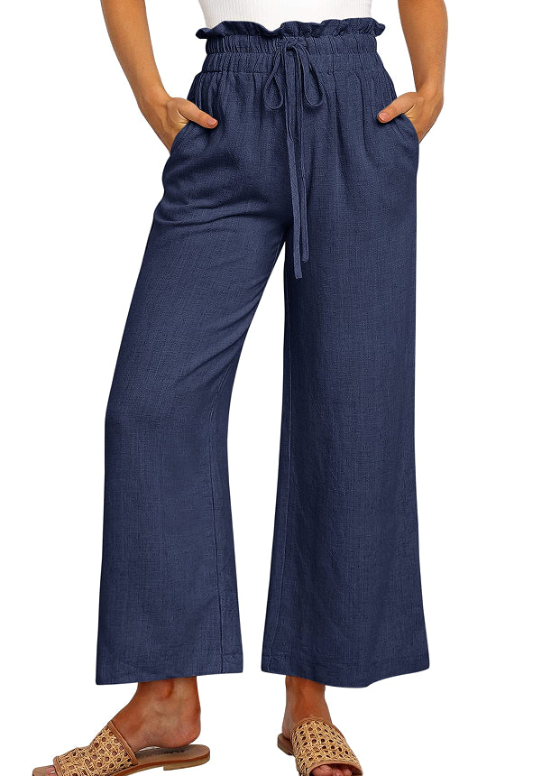 Pantalon large à taille élastique, lacets et coupe courte de couleur unie