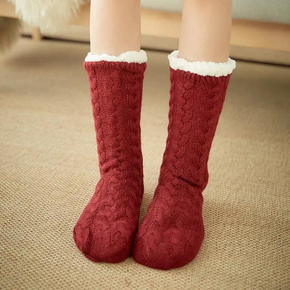 Socks, a pair of red cable-knit with white faux fur trim.
