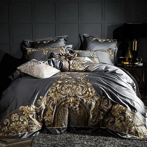 Embroidered quilt cover bedding set in dark gray with gold ornate pattern and matching pillow shams