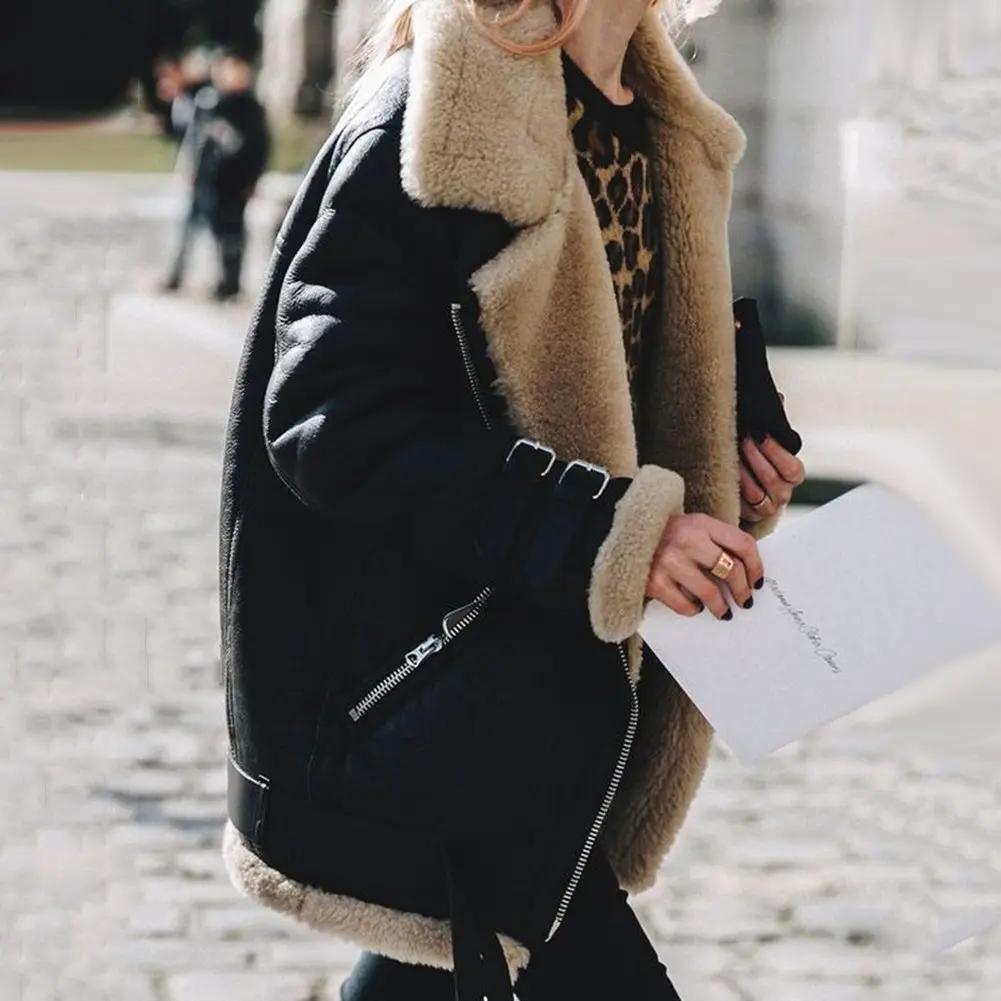 Women’s black faux shearling jacket with beige fur trim and zip pockets