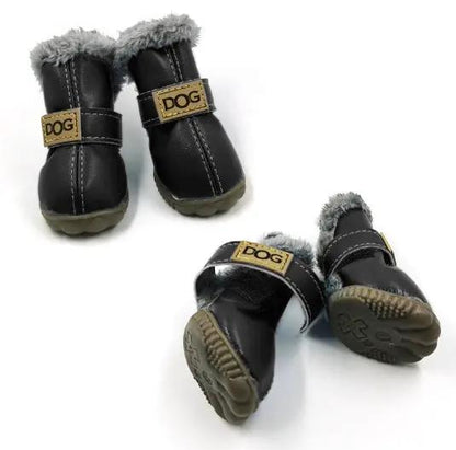 AdTec dog snow boots, black with gray faux-fur lining and tan label, set of two.