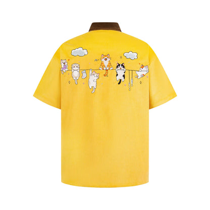 Embroidered corduroy color-blocked short-sleeve shirt; bright yellow with brown collar and cats-on-clothesline embroidery