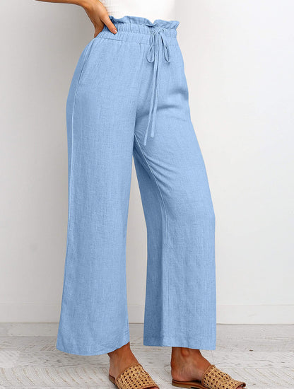 Pantalon large à taille élastique, lacets et coupe courte de couleur unie