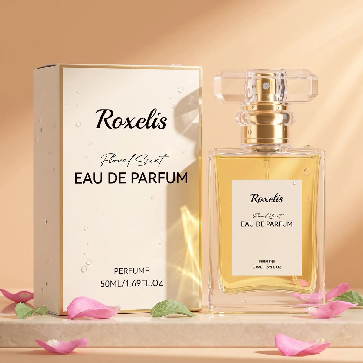 Roxelis Eau de Parfum bottle and matching box; clear glass with gold accents, floral scent