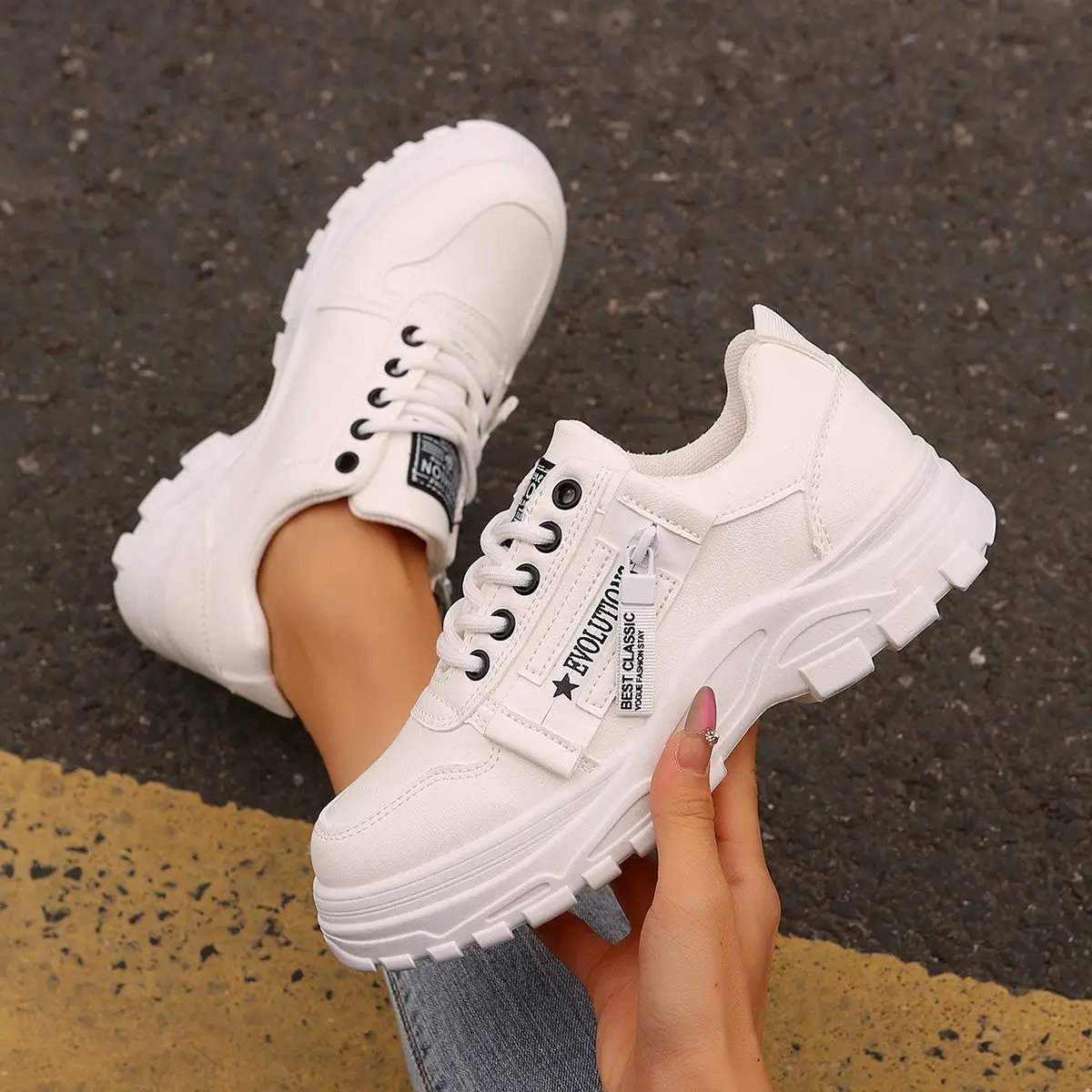 Pair of white lace-up sneakers with side zipper and thick sole, AdTec