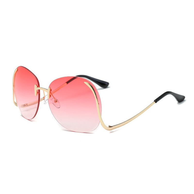 Lunettes de soleil sans monture à branches incurvées et décoratives