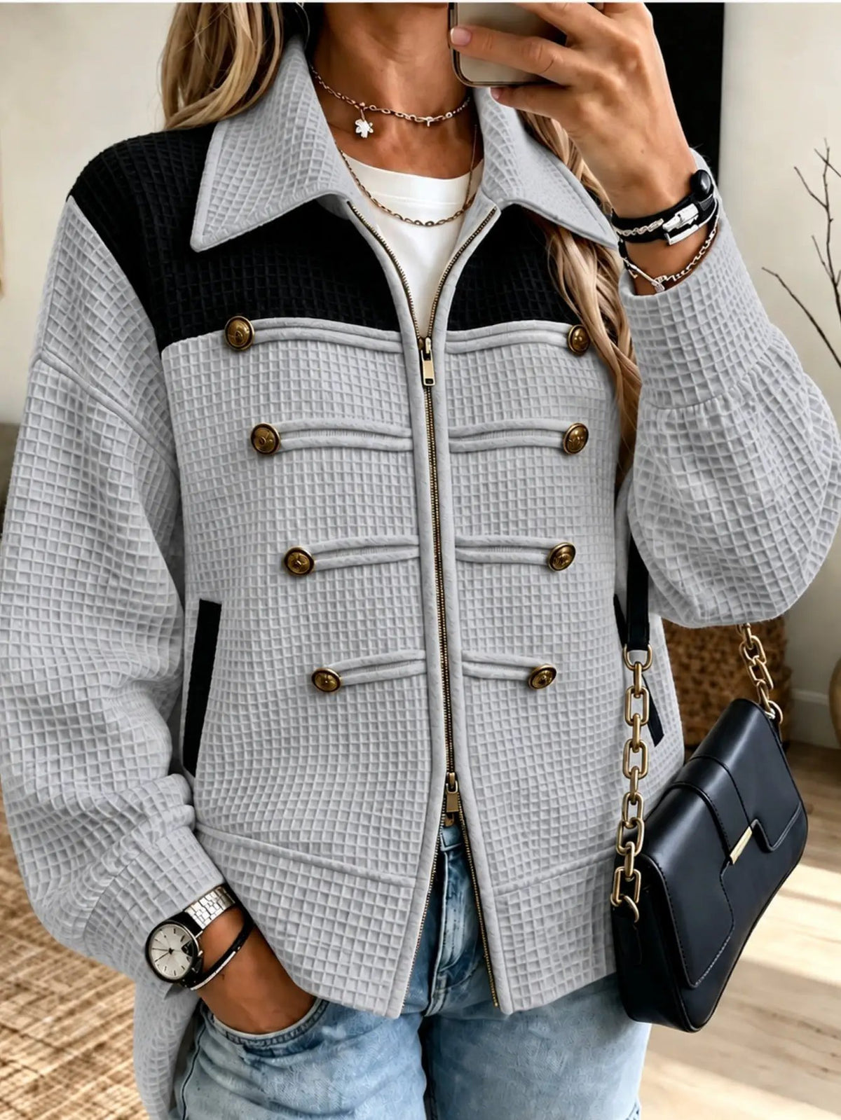 Lady's quilted gray jacket with black yoke, gold-tone buttons, and front zipper