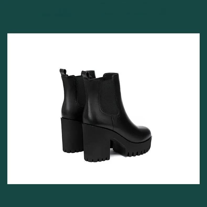 Women's black genuine leather Chelsea boots, a pair with chunky platform heels and lug soles.