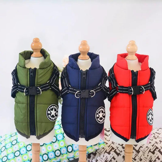 Waterproof dog coat with harness; three puffer jackets in green, blue, and red.