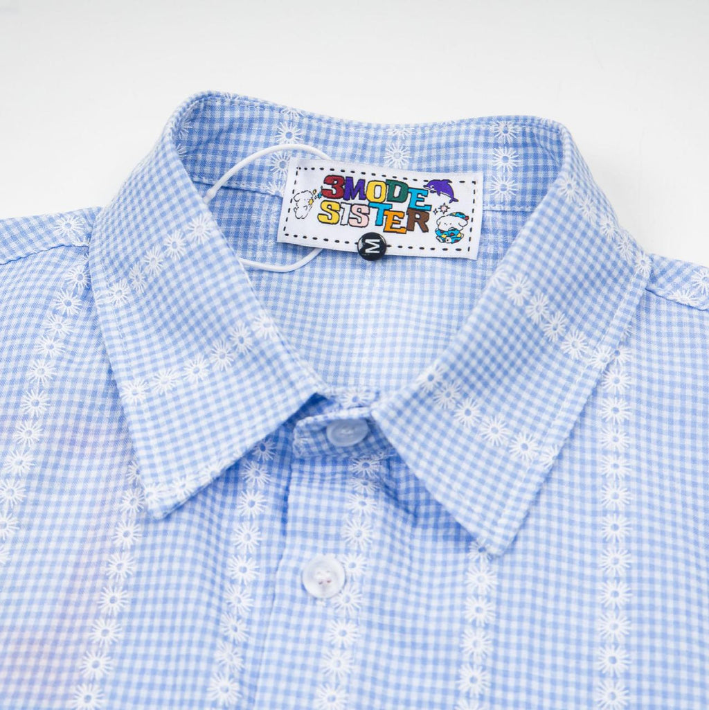 Camisa de manga corta a cuadros con grafiti floral