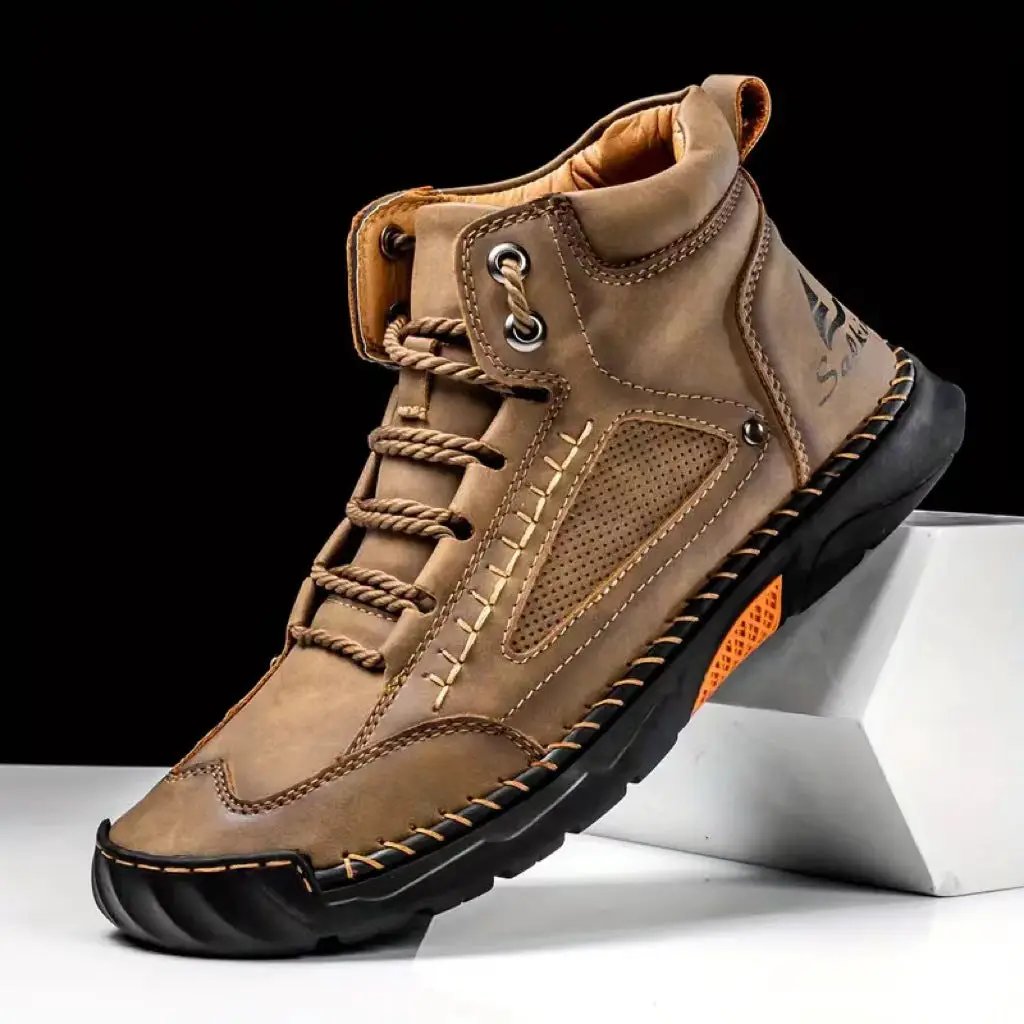 Aveline Handcrafted Ankle Boots by AdTec in tan leather with a rugged black outsole and orange accent.