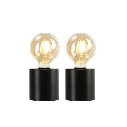 7-inch tall black battery-powered table lamps (set of 2) with clear glass Edison bulbs and black cylindrical bases.