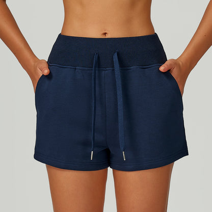 Short de sport molletonné taille haute avec cordon de serrage et poches pour l'extérieur