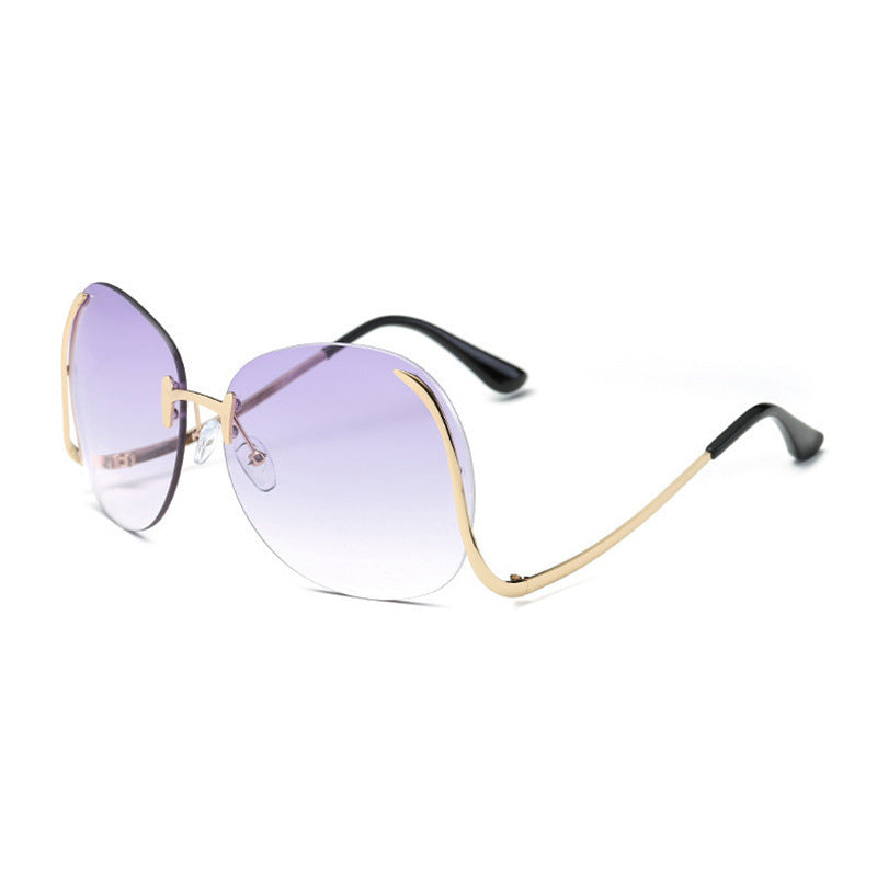 Lunettes de soleil sans monture à branches incurvées et décoratives