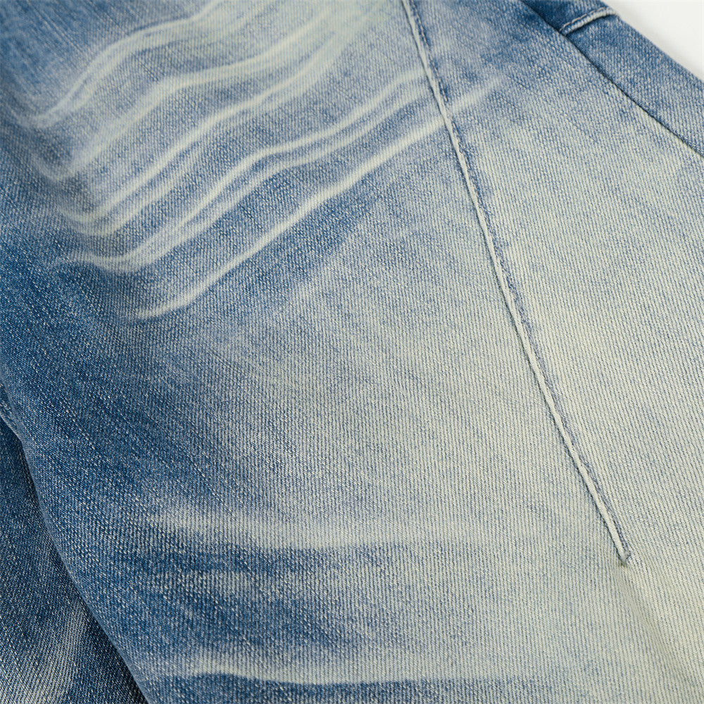 Jeans en jean délavé et poli à empiècements de couleur
