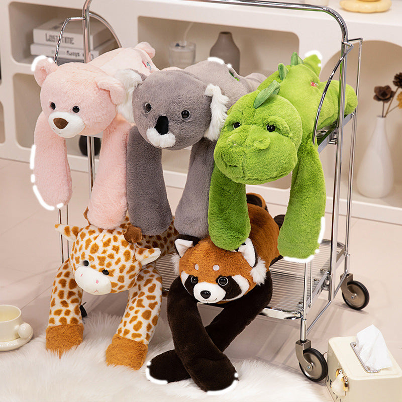 Peluche de dinosaurio, koala y oso tumbado