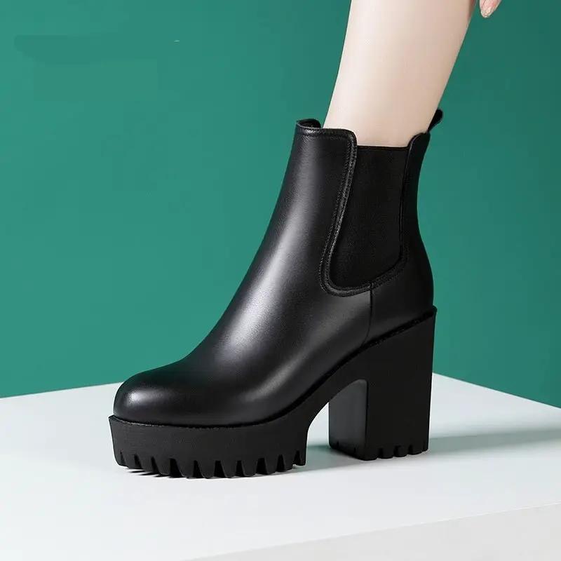 Women's solid black genuine leather mid-calf boot with elastic side panel and chunky platform heel