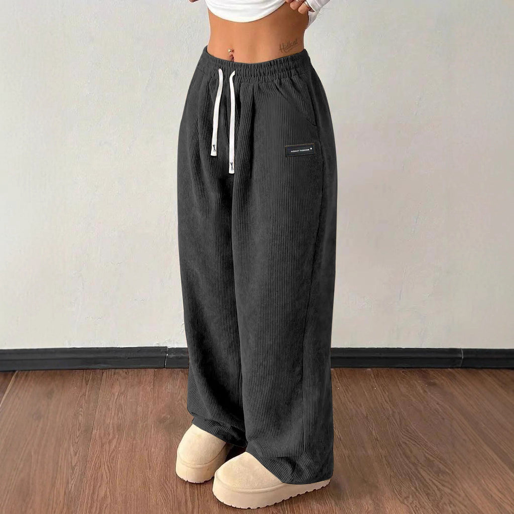 Pantalones de mujer informales versátiles de color liso con cordón suelto y bolsillos
