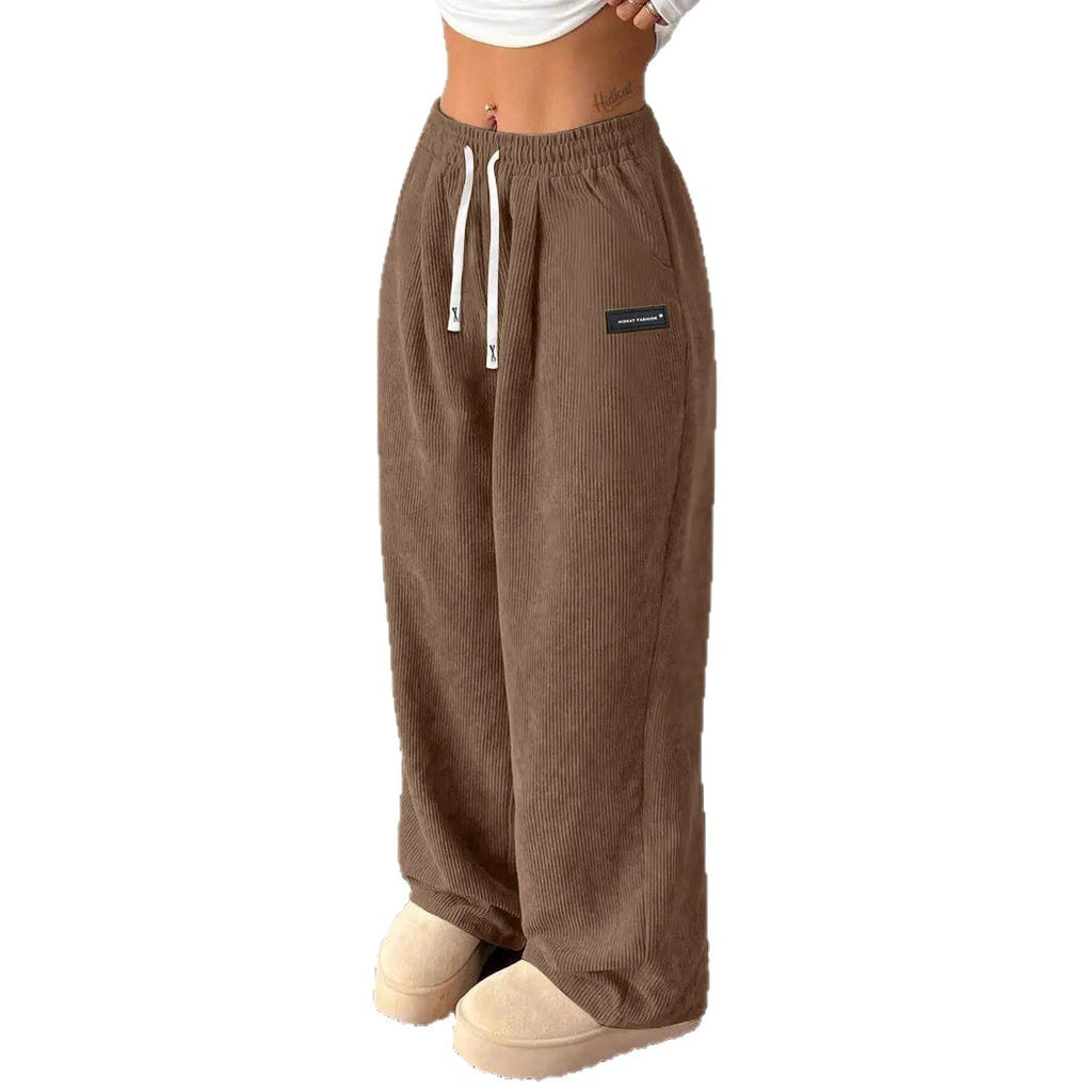 Pantalones de mujer informales versátiles de color liso con cordón suelto y bolsillos