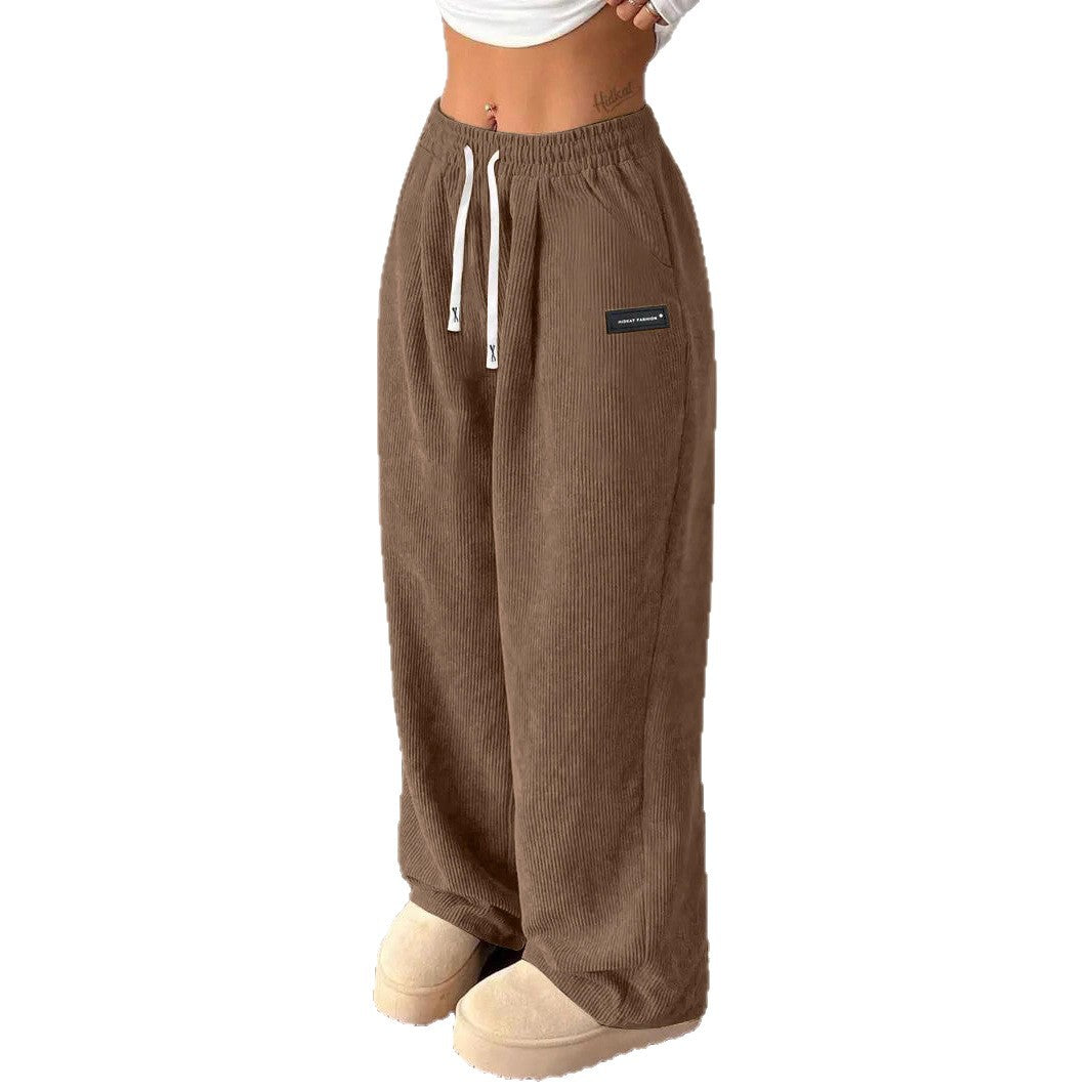 Pantalones de mujer informales versátiles de color liso con cordón suelto y bolsillos