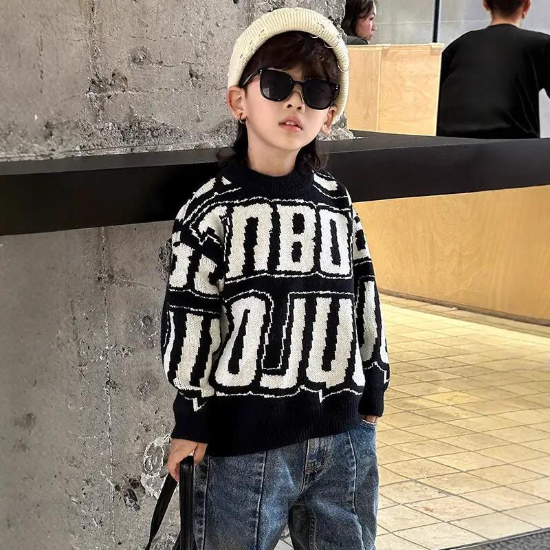 Boys warm thickened knit sweater with long sleeves in black and white geometric pattern.