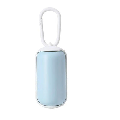 Portable pet poop bag dispenser for cats and dogs, light blue capsule with white trim and a carabiner