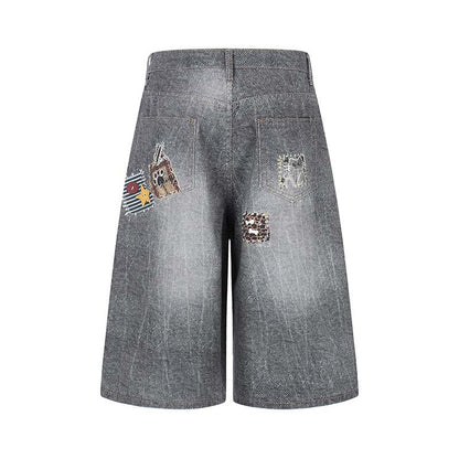 Shorts en jean délavé à motif imprimé
