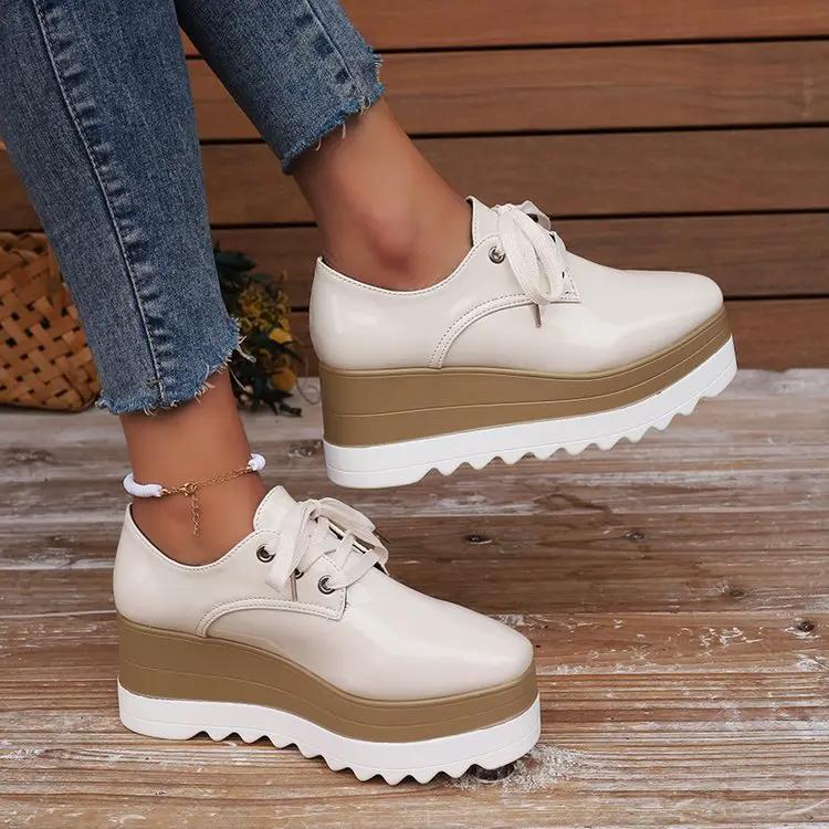 Womens lace-up square-toe patent leather platform wedge heels, cream with tan stacked midsole and white outsole, pair