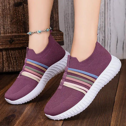 AdTec women's casual breathable mesh slip-on sneakers with white sole, purple knit and striped accents.