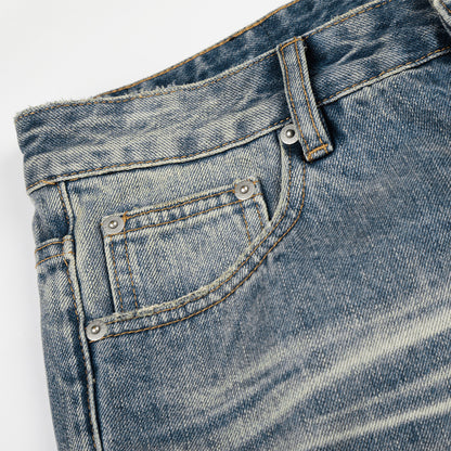 Whitewashed ripped denim micro pull pants
