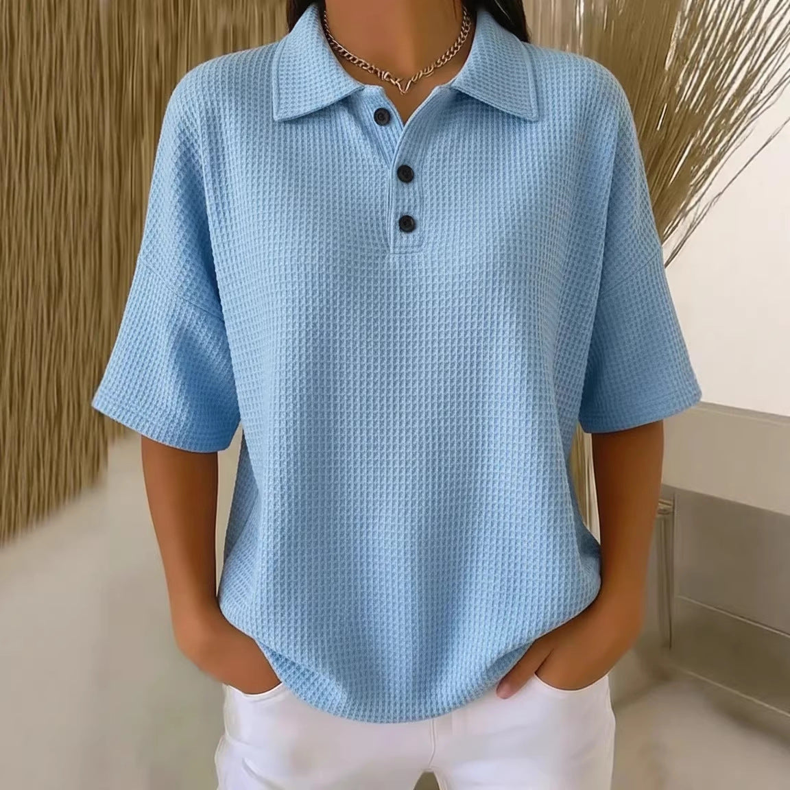 T-shirt boutonné en tricot gaufré à manches courtes, coupe pull, couleur unie