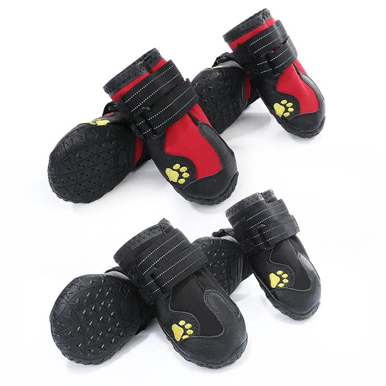 Pet dog foot cover waterproof boots by AdTec; black with red panels, yellow paw print, adjustable Velcro straps, 2 pairs