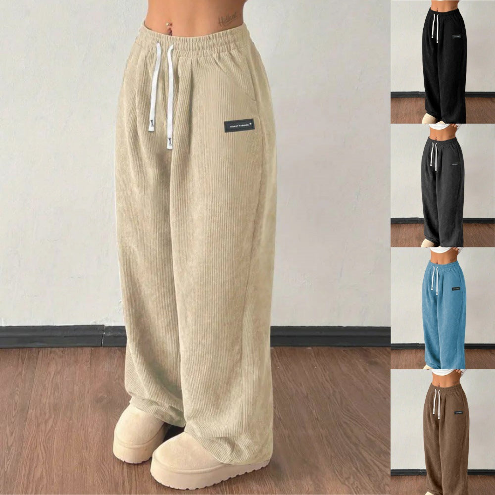 Pantalones de mujer informales versátiles de color liso con cordón suelto y bolsillos