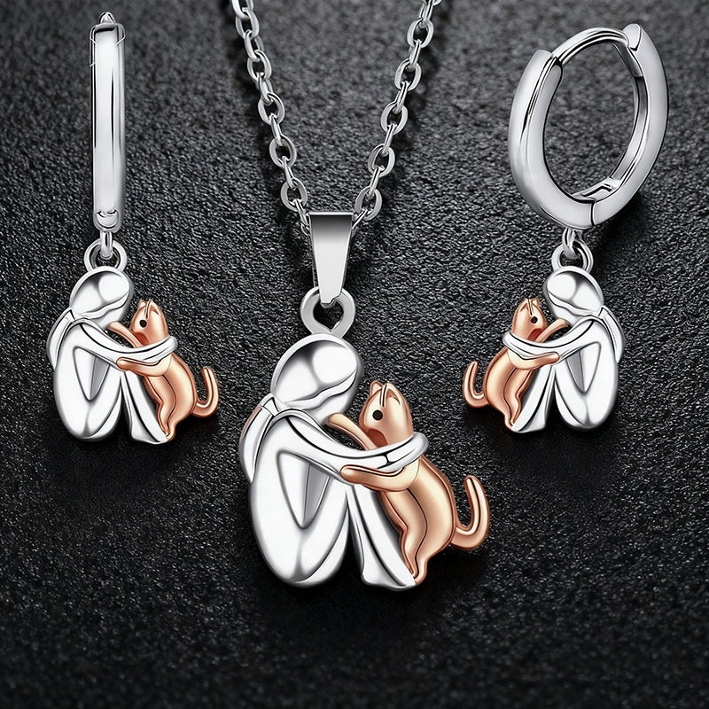Ensemble de boucles d'oreilles Fillette et Chien s'enlaçant