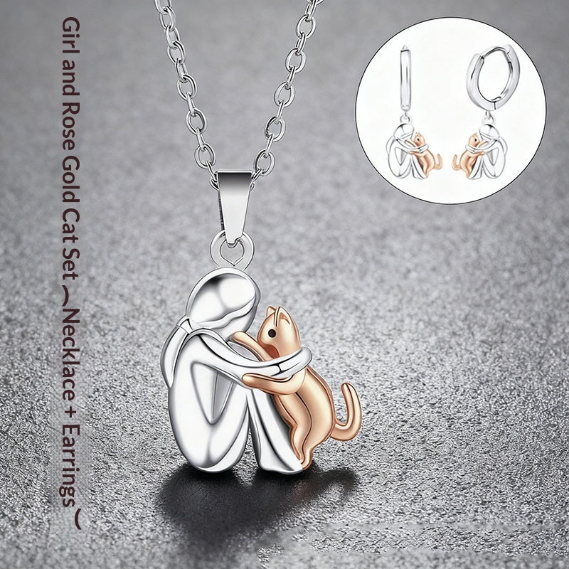 Ensemble de boucles d'oreilles Fillette et Chien s'enlaçant