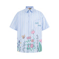 Camisa de manga corta a cuadros con grafiti floral