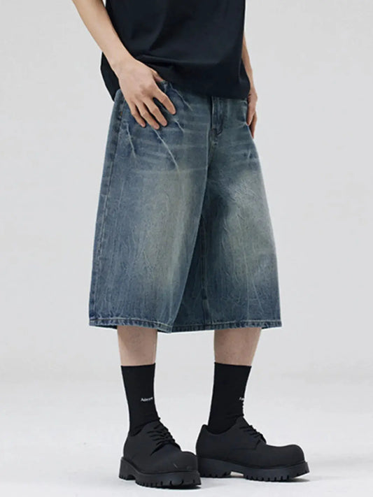 Men's oversized wide-leg distressed denim shorts in faded wash