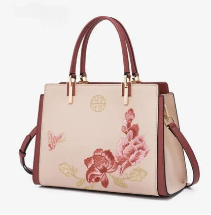 AdTec handbag tote with floral embroidery, beige-pink body, burgundy trim and gold hardware