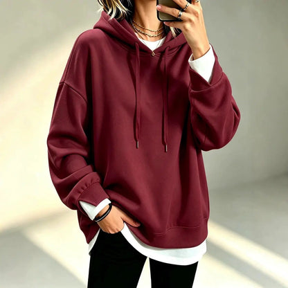 Plus-size loose-fit long-sleeve solid-color hoodie in burgundy, layered over a white tee.