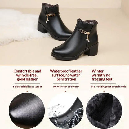 AdTec black leather ankle boots with gold-tone chain embellishment and chunky heel