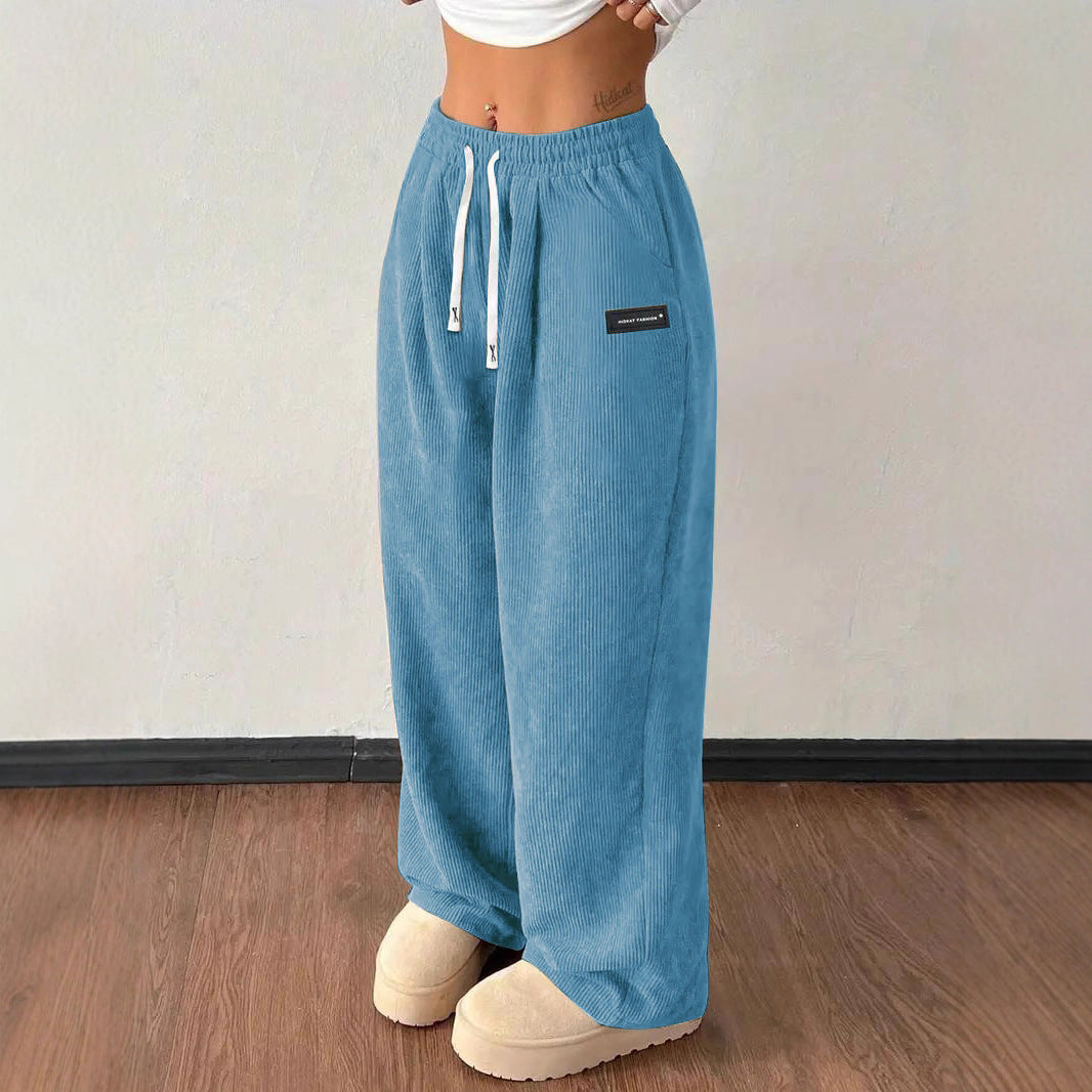 Pantalones de mujer informales versátiles de color liso con cordón suelto y bolsillos