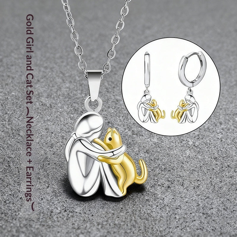 Ensemble de boucles d'oreilles Fillette et Chien s'enlaçant