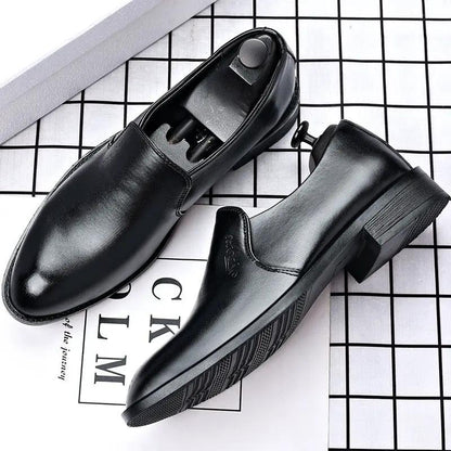 Pair of men's black AdTec leather slip-on dress shoes with pointed toe