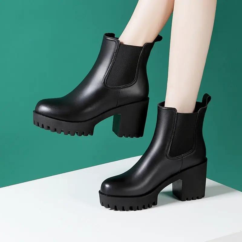 Women's black genuine leather mid-calf boots with chunky platform heel and lug sole.